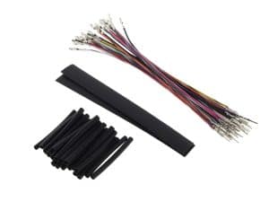 Multicoloured motorcycle wiring harness with connectors and heat shrink tubing for Revelry Motorcycles.