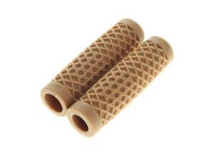 Soft beige motorcycle handlebar grips with textured pattern for enhanced grip.