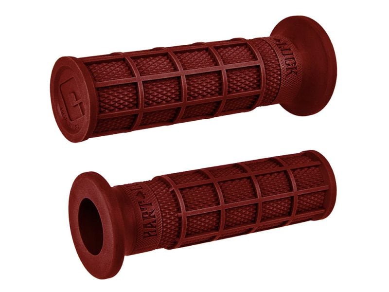 Red motorcycle handlebar grips for enhanced grip and control.