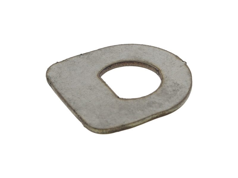 Metal motorcycle part with a worn finish and engraved shape.