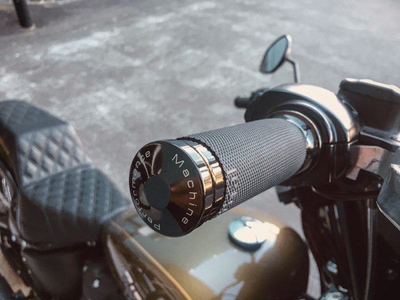 Handlebar grip with Revelry Cycles logo, motorcycle accessories, custom bike parts.