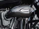 High-performance motorcycle air intake with carbon fiber finish at Revelry Motorcycles.
