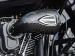 Revelry Motorcycles high-performance carbon fibre motorcycle engine component with "Performance Machine" branding, providing speed and style.