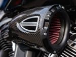 Performance motorcycle air intake, sleek carbon fiber design, enhancing bike speed and efficiency.