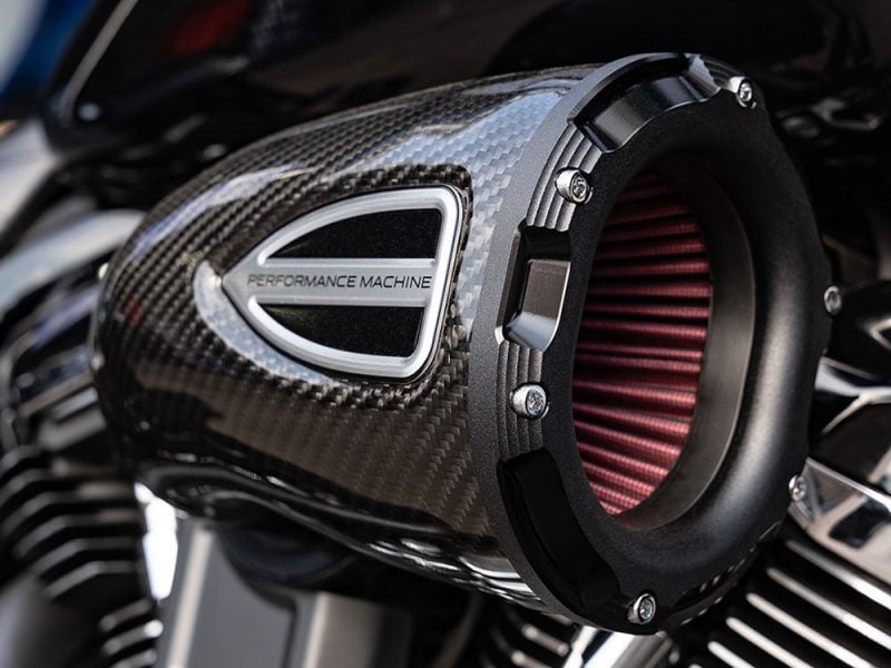 Performance motorcycle air intake, sleek carbon fiber design, enhancing bike speed and efficiency.