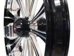 Shiny motorcycle wheel with black and chrome finish, perfect for custom bike builds.