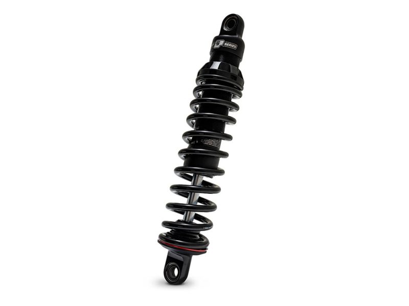 High-performance motorcycle shock absorber by Revelry Motorcycles, designed for superior ride comfort and stability.
