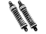 Black motorcycle shock absorbers, high-performance suspension components for Revelry Motorcycles.
