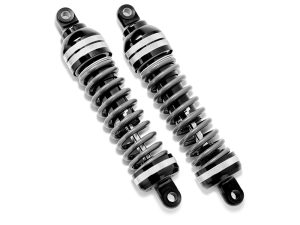 Black motorcycle shock absorbers, high-performance suspension components for Revelry Motorcycles.