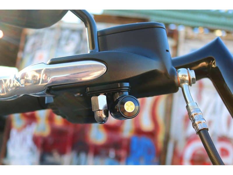 Rugged motorcycle handlebar with electronic controls and throttle for adventure riding.