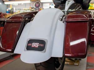 High-quality motorcycle rear fender with Revelry Motorcycles branding and custom finish.