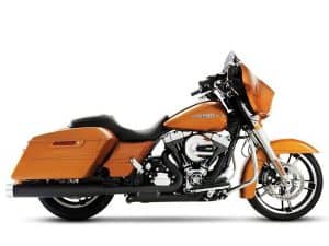 Vivid orange Harley-Davidson touring motorcycle with saddlebags and chrome accents.