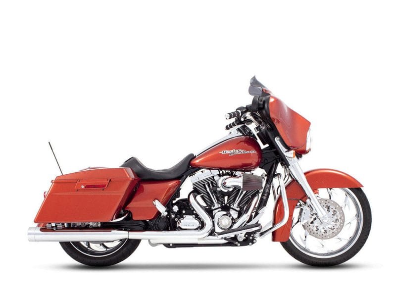 Vivid orange Harley-Davidson touring motorcycle with deluxe touring gear, ideal for long rides.