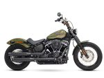 Harley-Davidson cruiser motorcycle in matte green with black exhaust and classic styling.