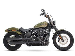 Harley-Davidson cruiser motorcycle in matte green with black exhaust and classic styling.