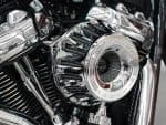 Shiny chrome motorcycle engine close-up, high-performance Harley-Davidson custom parts.
