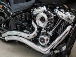 Shiny chrome Harley-Davidson motorcycle engine with detailed components.