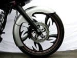 Sleek motorcycle front wheel with custom black and white rim design.