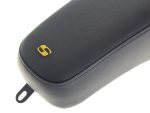 Black motorcycle accessory case with gold logo, durable design, and premium finish.