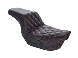 Leather motorcycle seat with red stitching, comfortable and stylish for motorcycle riders.