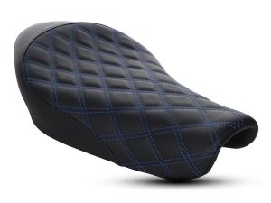 Comfortable black motorcycle seat with blue stitching for cruiser bikes.