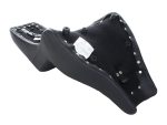 Leather motorcycle seat with black upholstery and metal rivets for Harley Davidson bikes.