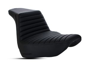 Vintage black motorcycle seat with ribbed leather design for Harley Davidson bikes.
