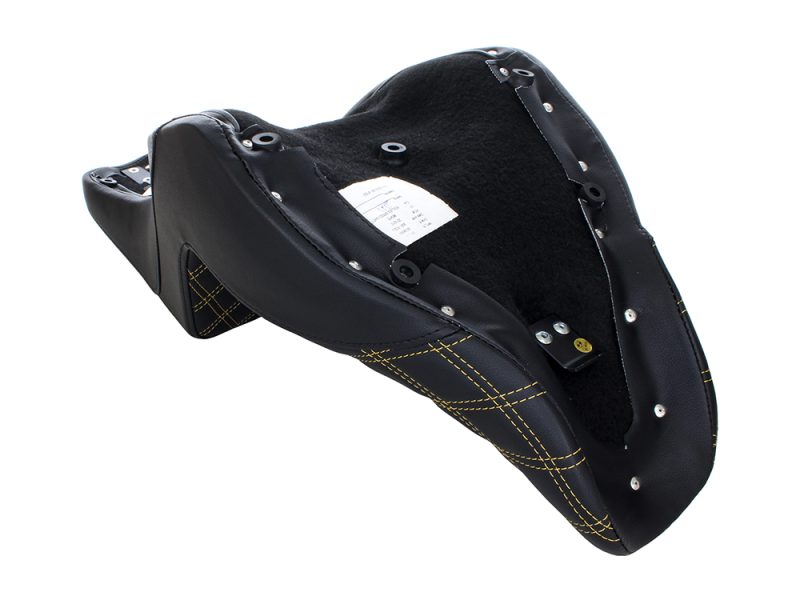 Motorcycle seat with black leather and yellow stitching for custom cafe racer bikes.