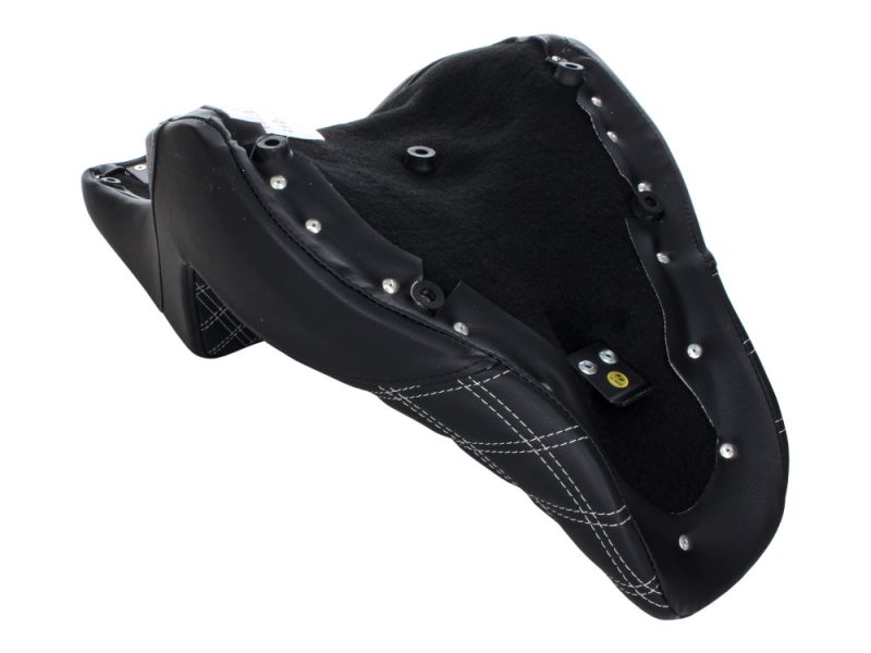 Leather motorbike seat with black quilted stitching for Revelry Motorcycles.