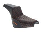 V-Twin motorcycle seat with black and orange hex pattern stitching for Revelry Motorcycles enthusiasts.