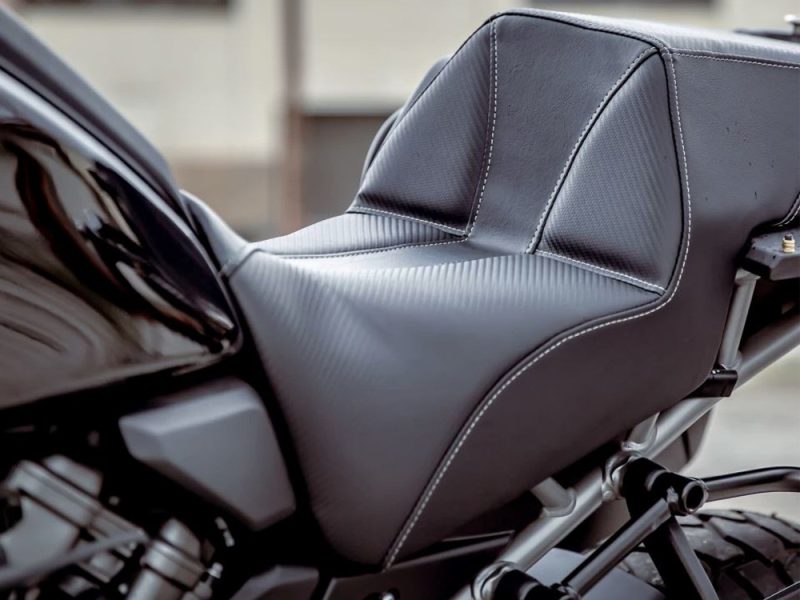 Premium black motorcycle seat with sleek stitching for Revelry Motorcycles enthusiasts.