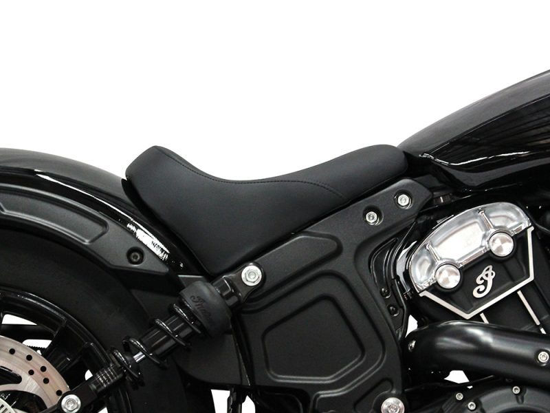 Black cruiser motorcycle seat and engine components, showcasing sleek design and high-quality craftsmanship.
