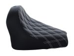 Rugged black motorcycle seat with white stitching, perfect for comfort and style.