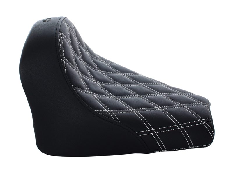 Rugged black motorcycle seat with white stitching, perfect for comfort and style.