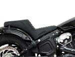 V-Twin motorcycle seat and engine parts in black, showcasing custom motorcycle accessories.