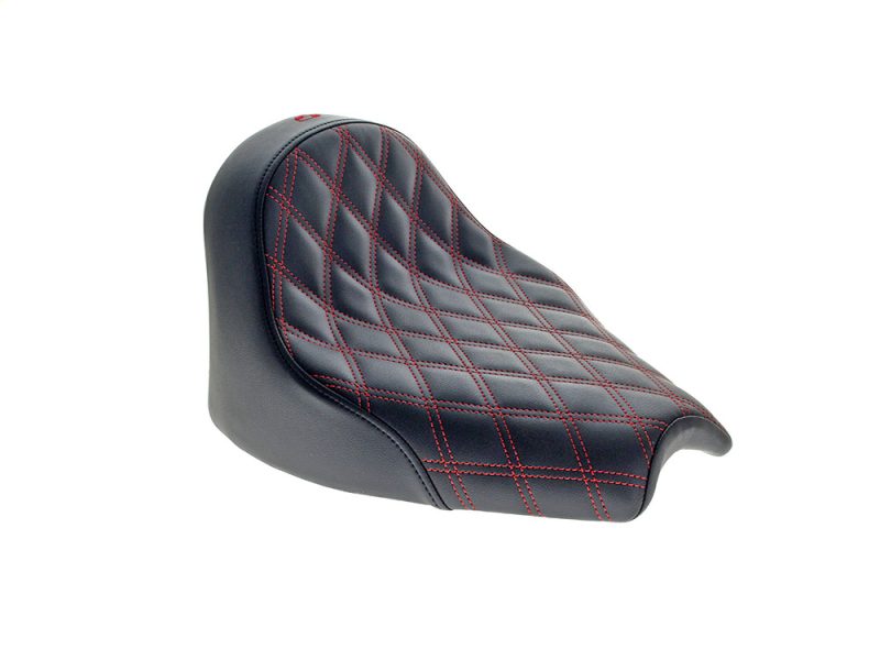 Saddle seat for motorcycle with diamond-stitched black leather and red contrast stitching.