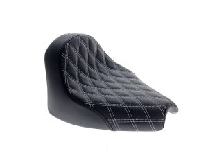 Smooth black motorcycle seat with white stitching, perfect for custom Revelry Motorcycles.