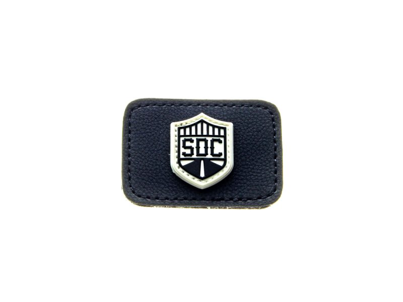 Leather motorcycle badge with shield logo and "SOC" text, perfect for motorcycle gear or apparel.