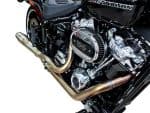 High-performance Harley-Davidson motorcycle engine with chrome details and custom exhaust pipes.