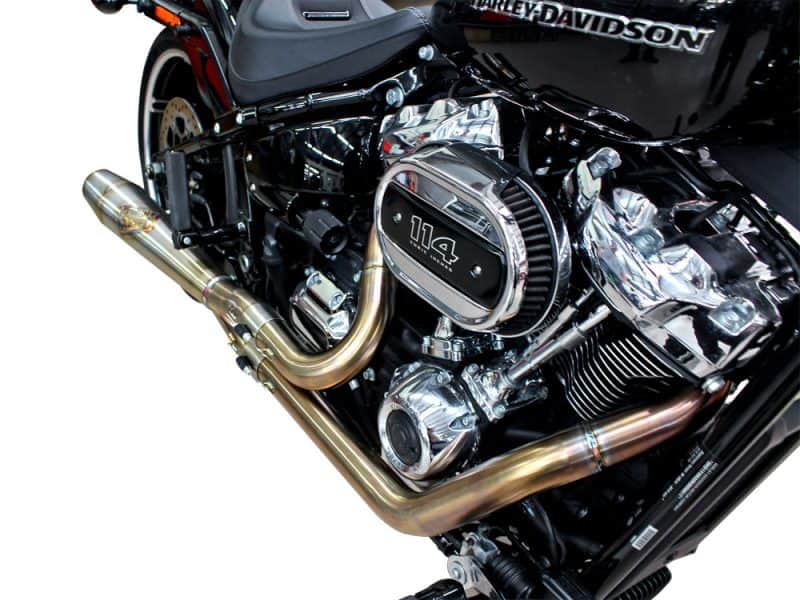 High-performance Harley-Davidson motorcycle engine with chrome details and custom exhaust pipes.