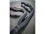 Sleek black motorcycle exhaust pipes with gold accents, ideal for custom motorbikes and enhancing performance.