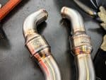 High-performance motorcycle exhaust pipes for Revelry Cycles enthusiasts.