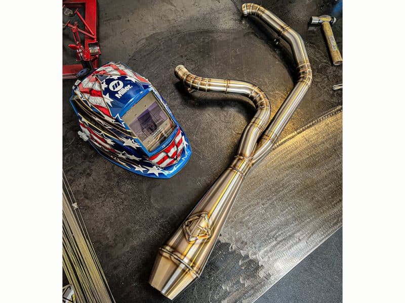 2-into-1 4.5in. Works Edition Big Bore Exhaust - Stainless Steel. Fits Dyna 2006-2017 High-performance motorcycle exhaust system with custom bends and piping for Revelry Motorcycles.
