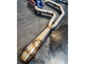 High-performance motorcycle exhaust system with custom design and welding, suitable for Revelry Motorcycles.