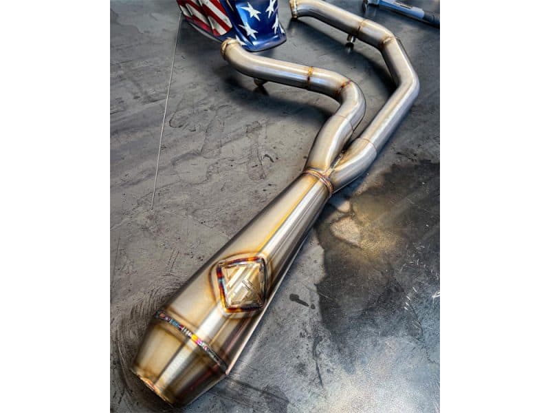 High-performance motorcycle exhaust system with custom design and welding, suitable for Revelry Motorcycles.