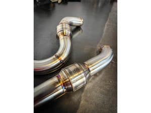 High-performance motorcycle exhaust pipes for Revelry Motorcycles.