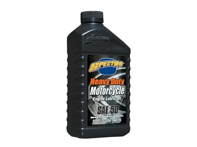 Black motorcycle engine oil bottle with Spectro Heavy Duty Motorbike Lubricant label.