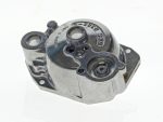 Aluminium motorcycle engine part with engraved serial number and mounting holes.