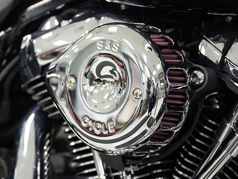 Polished Harley-Davidson motorcycle engine details, showcasing custom Revelry Cycles craftsmanship.