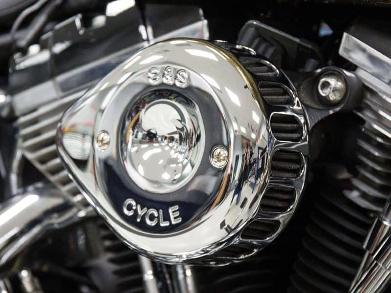 Shiny chrome motorcycle engine part with "Cycle" and "S&S" engravings for Revelry Motorcycles.